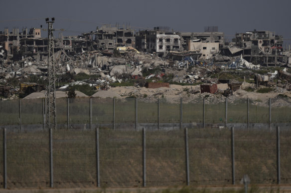 Destroyed buildings stand in the Gaza Strip as seen from southern Israel on Thursday.