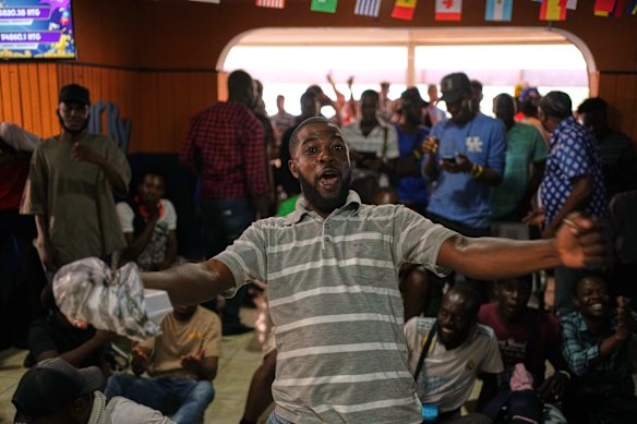 Soccer fans attend a World Cup watch party for the match between Morocco and Haiti in Port-au-Prince, Haiti.