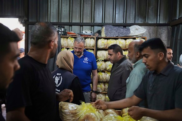Palestinians bake bread last Thursday after the World Food Program was able to bring in flour for the first time in over a month.
