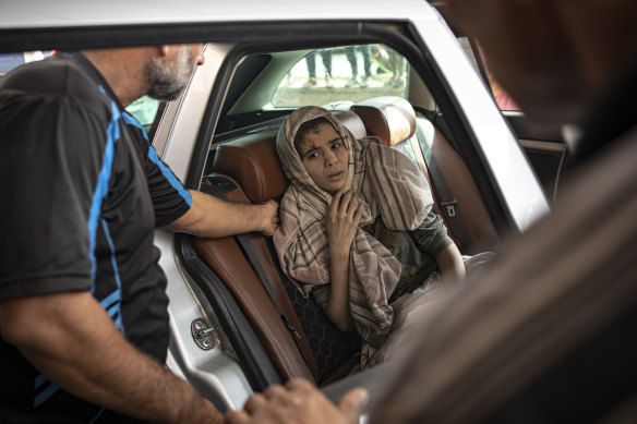 A Palestinian wounded in Israeli bombardment of the Gaza Strip is brought to a hospital in Khan Younis.