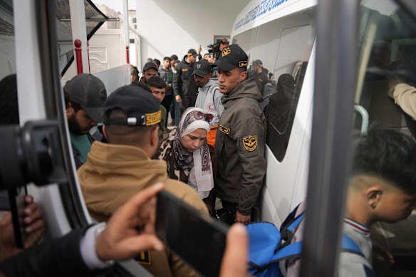Palestinian patients board a vehicle in Khan Younis on their way to the Rafah crossing, as they leave the Gaza Strip for medical treatment abroad.