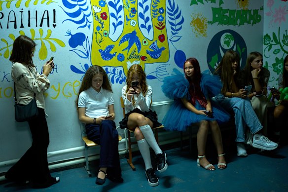 Young girls sit in a shelter during an air-raid alarm during the traditional back-to-school celebrations earlier this month.
