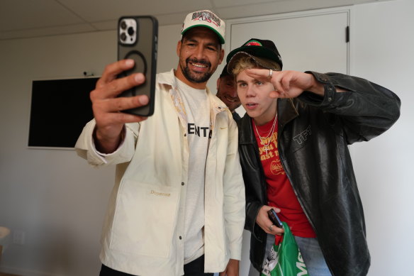 Rabbitohs fan and global superstar Kid Laroi with Cody Walker and Jai Arrow.
