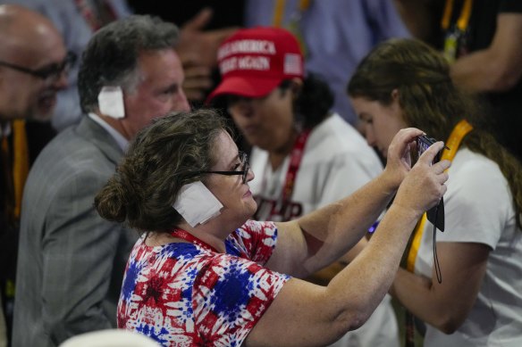 Trump supporters imitating the bandage dressing on the former president’s ear.