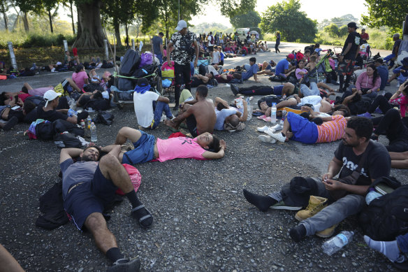Migrants, who are part of a caravan heading towards the country’s northern border and ultimately the United States, rest on the outskirts of Escuintla, southern Mexico.