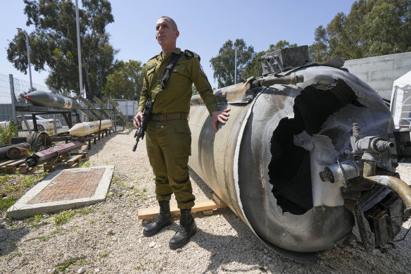 Israeli military spokesperson, Rear Admiral Daniel Hagari, shows one of the Iranian ballistic missiles intercepted at the weekend, in Julis army base, southern Israel.