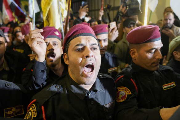 Members of an Iraqi Shiite militant group attend the funeral of a fighter who was killed in a US airstrike Province, in Baghdad, Iraq.