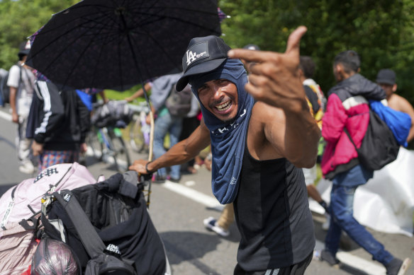 Venezuelan migrant Jonathan Morales Aguilar appeals for humanitarian aid for people of a migrant caravan walking along the Huixtla highway in southern Mexico.