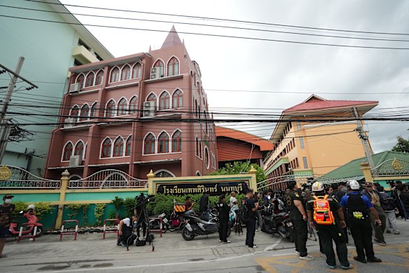 People gather the Debsirin Nonthaburi School.