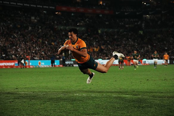 Joseph-Aukuso Suaalii scores a try after an intercept against South Africa in Johannesburg.