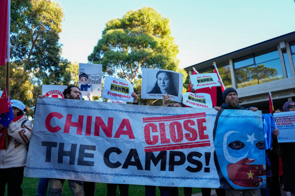 Uyghur protesters hold placards outside the Adelaide Zoo earlier this week during Chinese Premier Li Qiang’s four-day visit to Australia. 