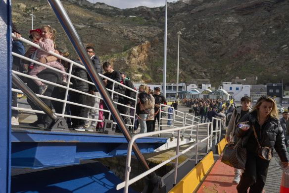 Passengers eager to flee Santorini board a ferry to Athens after a series of earthquakes.