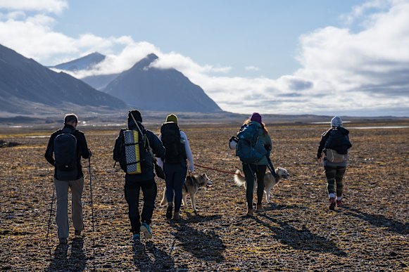Setting out on a guided wilderness hike from Basecamp Explorer Isfjord Radio.