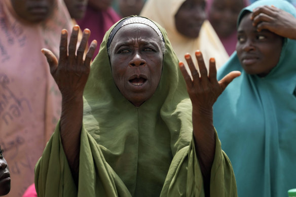 A woman prays for the kidnapped students in Kuriga, Nigeria.
