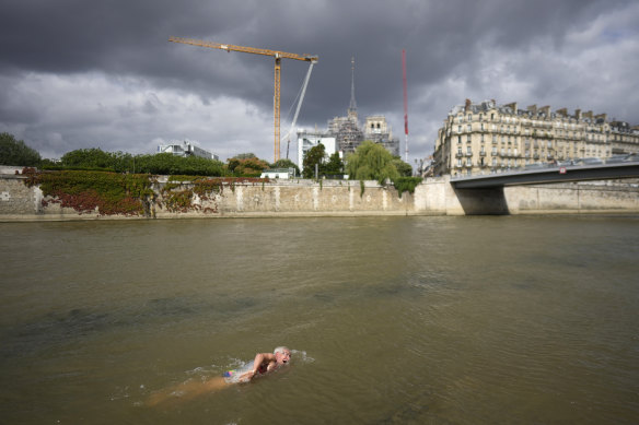 American Joel Stratte-McClure swims in the Seine. The journalist swam in the river in 1976 and recreated the feat last week, aged 75.