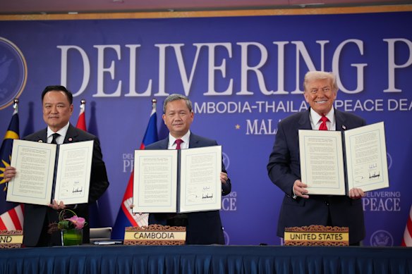 Thai Prime Minister Anutin Charnviraku (left), Cambodian Prime Minister Hun Manet and US President Donald Trump pose for photos following the signing of a Cambodia-Thailand peace deal in Kuala Lumpur on October 26.