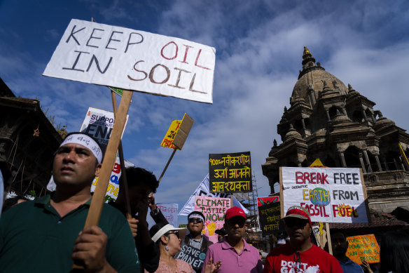 Climate activists gather to participate for Climate Justice March demanding an end to fossil fuels in Lalitpur, Nepal, on Saturday.