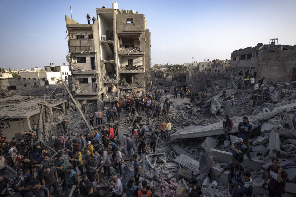 Palestinians look for survivors of the Israeli bombardment in the Maghazi refugee camp in the Gaza Strip.