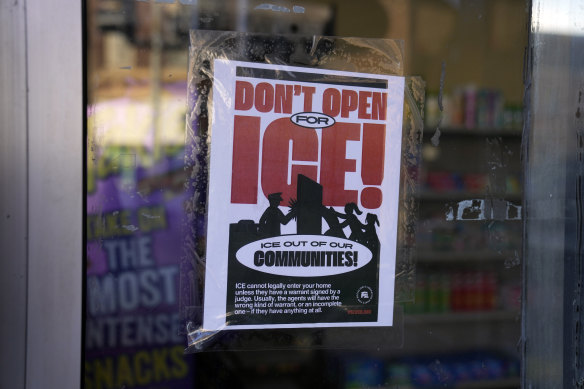 A sign to keep immigration officials out is displayed on the entrance to a 
store in Chicago’s predominantly Latino Little Village neighbourhood on the day of Trump’s inauguration.