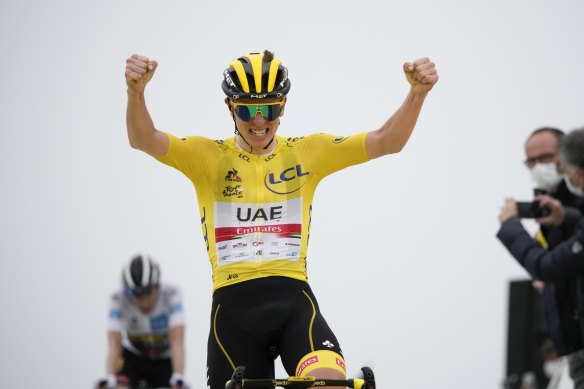 Tadej Pogacar, wearing the overall leader’s yellow jersey, crosses the finish line on Wednesday.