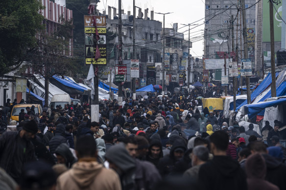 Palestinians buy supplies at the market in Rafah, Gaza Strip on Sunday.