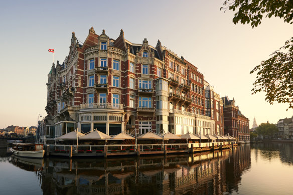 Board a classic wooden boat from the hotel’s riverside terrace for a private guided canal tour to the Van Gogh Museum.