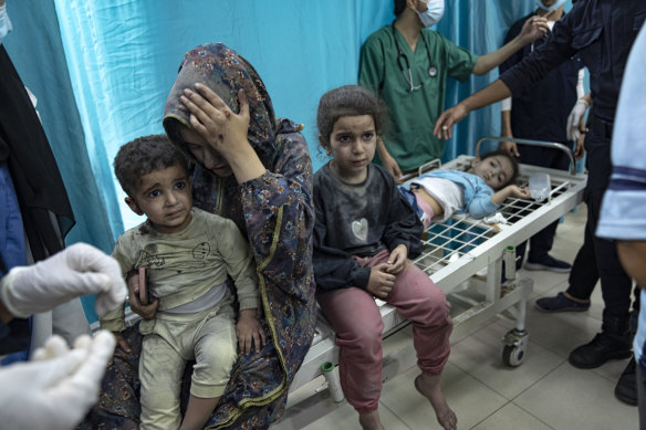 Palestinians wounded in Israeli bombardment of the Gaza Strip are brought to a hospital in Khan Younis.