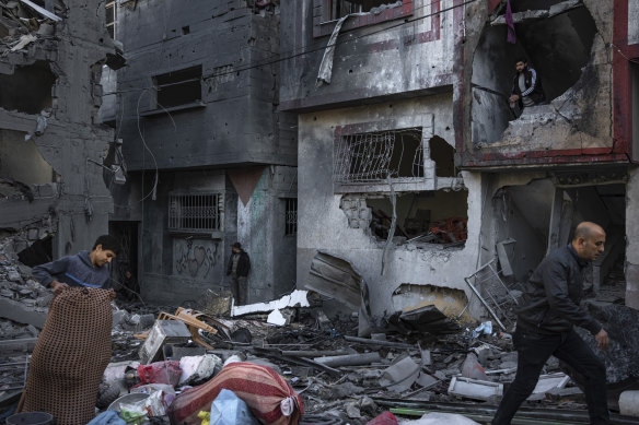 Palestinians examine houses destroyed in the Israeli bombardment of Rafah in the Gaza Strip at the weekend.