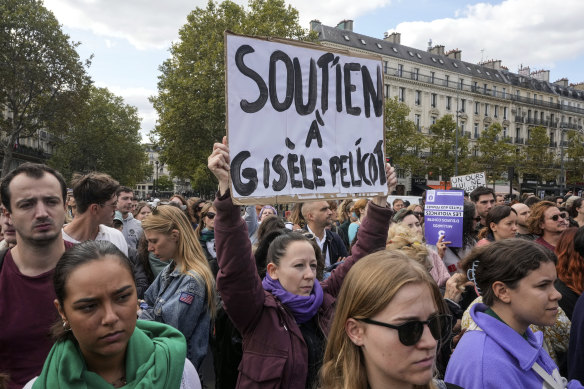 People gather to support Gisele Pelicot in Paris on Saturday. She was allegedly drugged by her ex-husband and raped while unconscious by dozens of men invited by him.