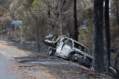 A wrecked car near Raglan, which was again on tenterhooks a week after fire swept through.