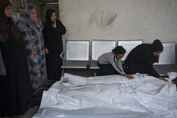 Palestinians mourn their relatives killed in the Israeli bombardment of the Gaza Strip, at the hospital Rafah, southern Gaza, on Thursday.