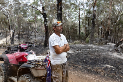 Adam Elliott takes a moment of respite as a light shower falls on his Glenlogie property.