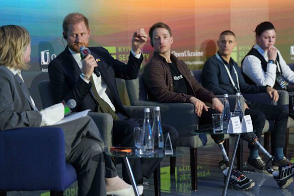 Harry speaks during a discussion with Ukrainian war veterans.