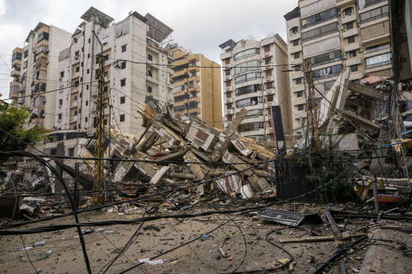 A damaged building is seen at the site of an Israeli airstrike in Beirut.