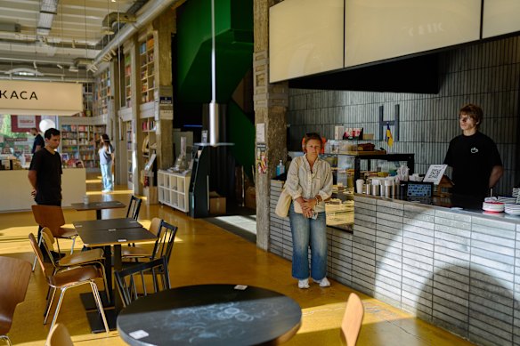 Life on hold: Customers and employees observe the daily national minute of silence in a Kyiv book shop.