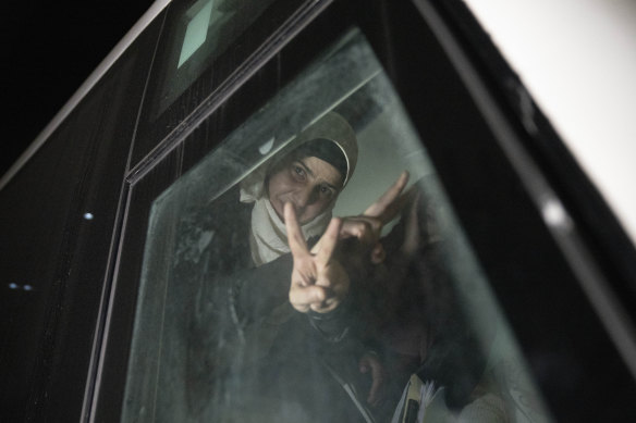 A Palestinian woman released from Israeli detention flashes the V sign on arriving in Beitunia.