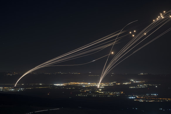 The Israeli Iron Dome air defence system fires to intercept an attack from Lebanon over the Galilee region as seen from the Israeli-annexed Golan Heights on Sunday.