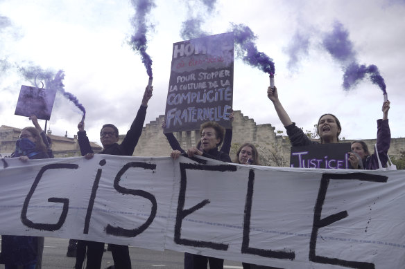 Women demonstrate to mark the International Day for the Elimination of Violence against Women on Monday, as the trial of dozens of men accused of raping Gisele Pelicot while she was drugged and rendered unconscious by her husband continues.