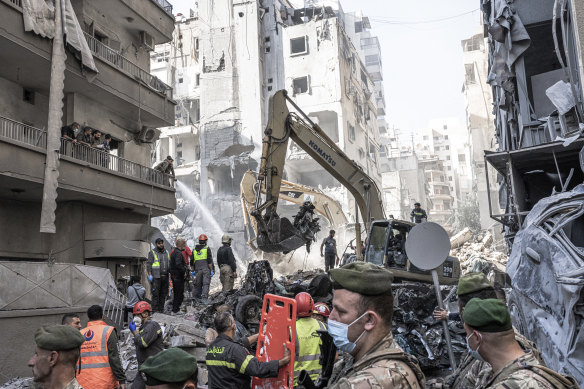 Civil defence members work to retrieve bodies trapped under the rubble after an Israeli airstrike in Beirut last weekend.