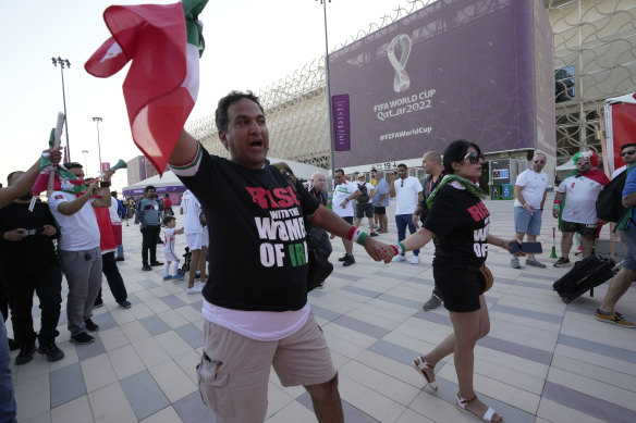 Protesters wear t-shirts reading “Rise with the women of Iran” outside the Ahmad Bin Ali Stadium, Al Rayyan, Qatar, on Friday.