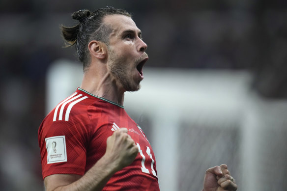 Gareth Bale celebrates the late penalty which earned Wales a point against the US.