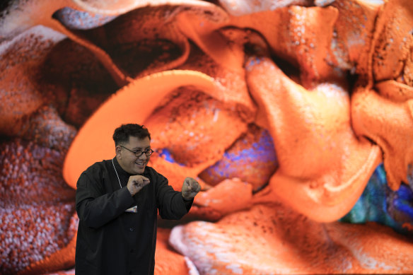 “Unsupervised”: Artist Refik Anadol describes his work in Davos, Switzerland last month. The AI-generated installation at the Museum of Modern Art in New York is meant to be a thought-provoking interpretation of the museum’s prestigious collection.