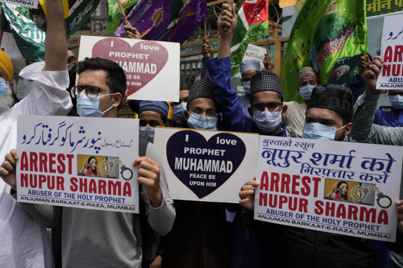 Indian Muslims in Mumbai hold placards demanding the arrest of Nupur Sharma, a spokesperson of governing Hindu nationalist party.