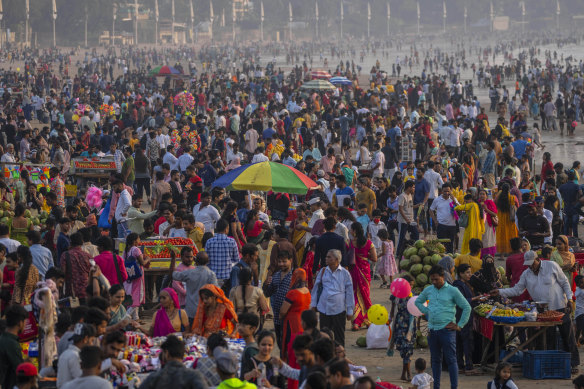 Beach crowds in Mumbai. India is now the world’s most populous nation. 