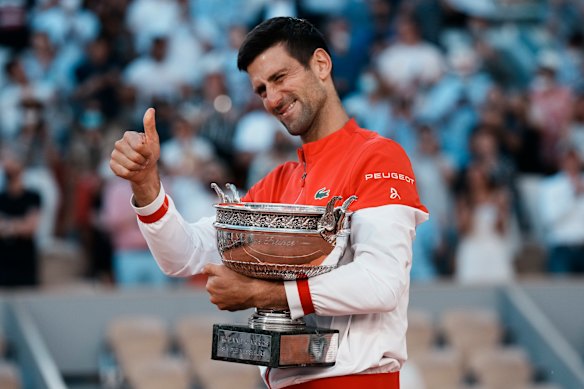 Thumbs up: Novak Djokovic will be able to defend his title at Roland Garros at this stage, organisers say.