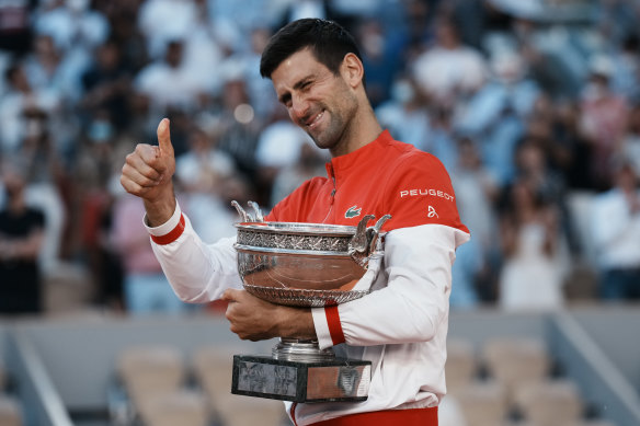 Thumbs up: Novak Djokovic will be able to defend his title at Roland Garros at this stage, organisers say.