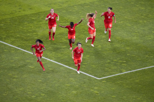 The Canadians celebrate their goal.