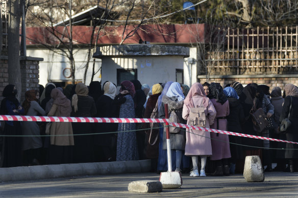 Afghan students queue outside Kabul University earlier this year. 