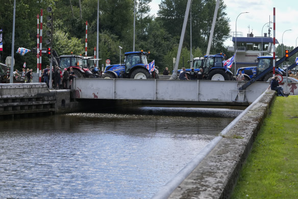 Protesting farmers block a draw bridge at a lock in the Princess Margriet canal, preventing all ship traffic from passing in Gaarkeuken, northern Netherlands.