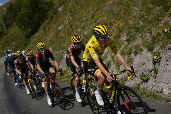 Jonas Vingegaard bides his time behind Tadej Pogacar prior to attacking on the final climb.